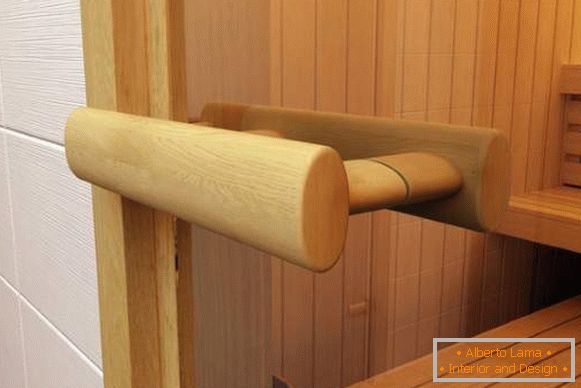 Wooden handle for glass doors in a sauna made of lime