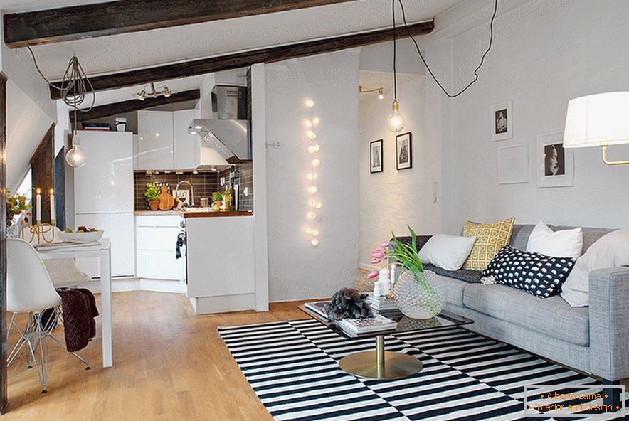 Kitchen and living room in a cozy attic in a Swedish town