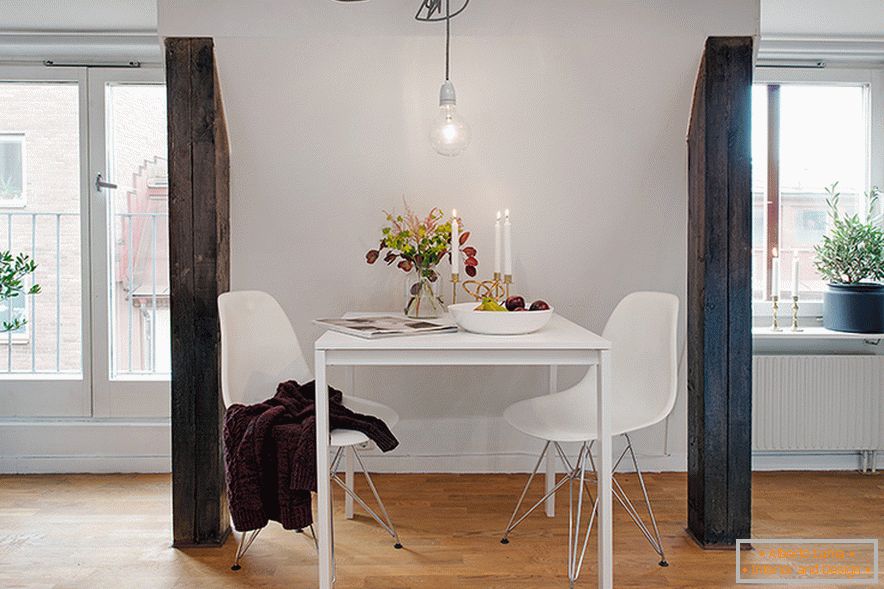 Table in the interior of a cozy attic in a Swedish city