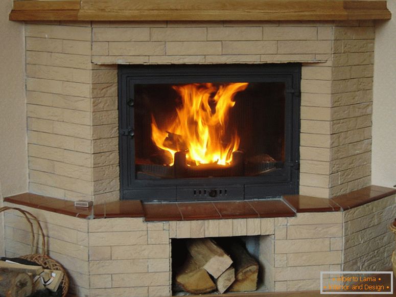 Corner fireplace made of bricks - comfort and coziness in a modern house.