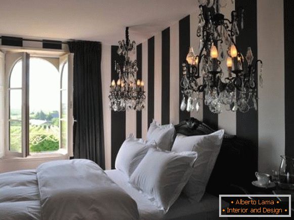 Black and white bedroom with two chandeliers