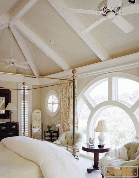 Round windows in the bedroom of a private house
