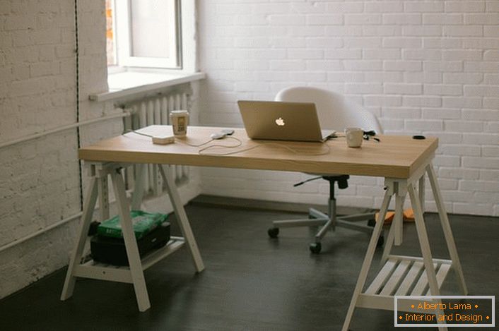 Laconically decorated workplace. White loft - the choice of creative, but moderately reserved people.