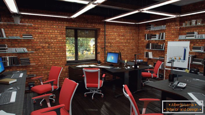 Red chairs in the office in the loft style look organically and creatively. The interior is as functional as possible.