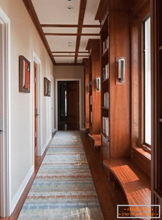 Home library in the corridor with windows