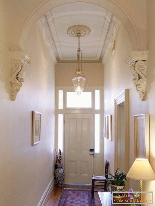 Corridor and anteroom in a classic style with stucco