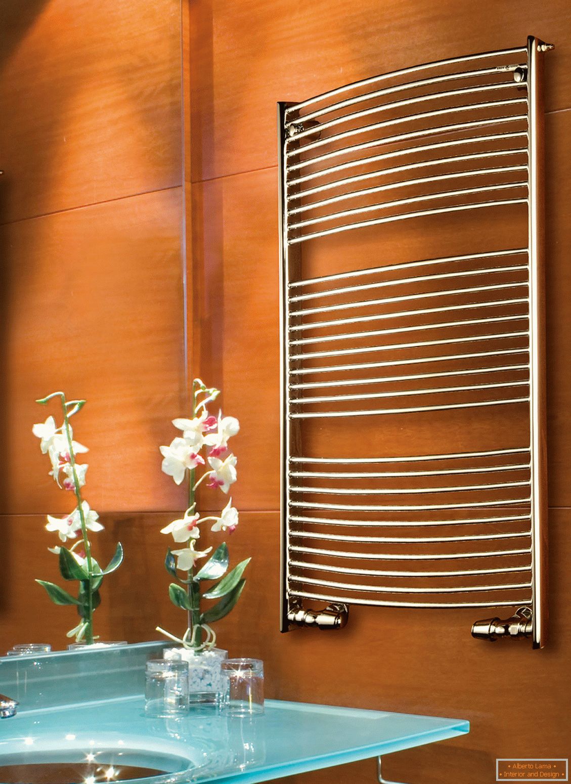 Heated towel rail on bathroom wall