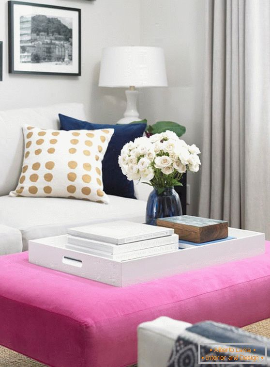 Female coffee table with upholstery in pink color