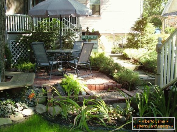 Patio with dining table and awning