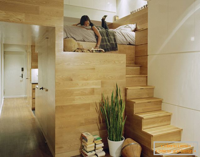 Two-level bed in a rectangular apartment with one window