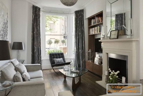 Beautiful layout of the living room - a photo with a bay window