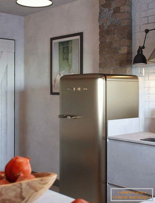 Refrigerator in the kitchen in loft style
