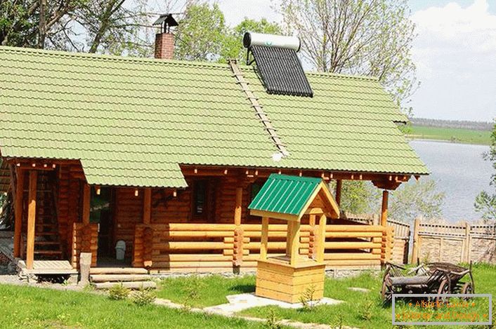 Banya from a log house in the style of a chalet on the shore of a reservoir near Moscow.