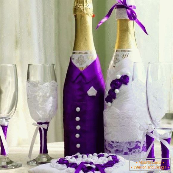 Decoration of bottles of champagne for the wedding - the bride and groom