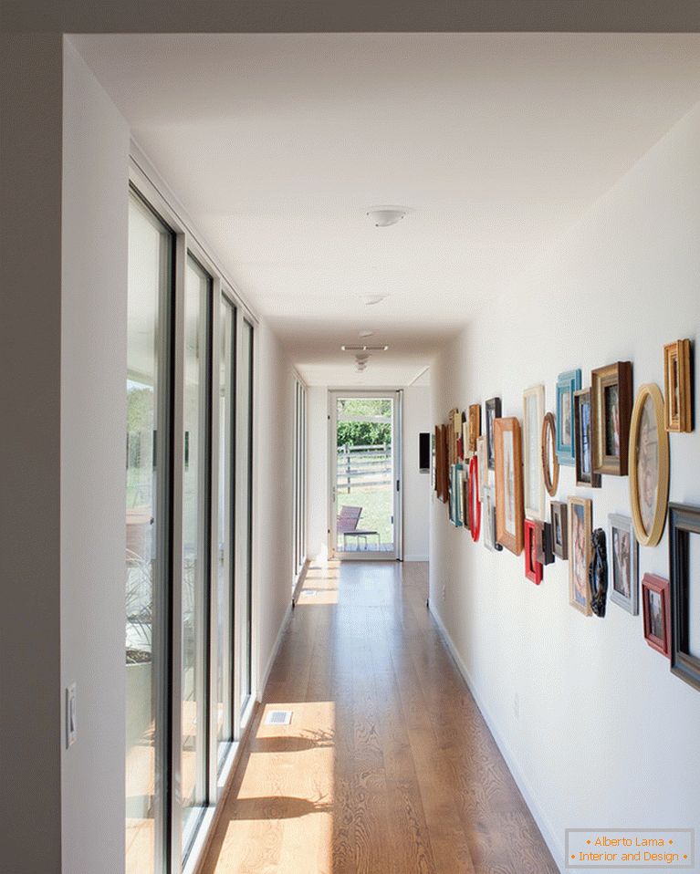 Paintings on the wall in a narrow corridor
