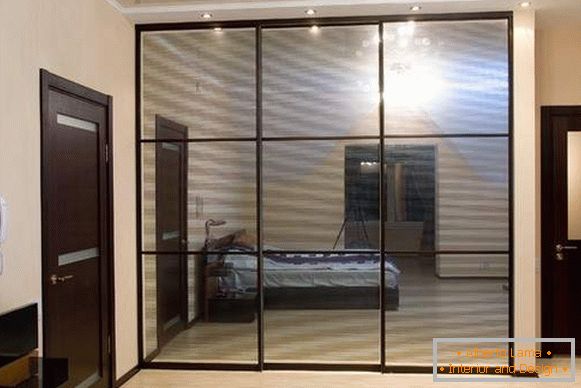 A beautiful built-in wardrobe with three mirrored doors