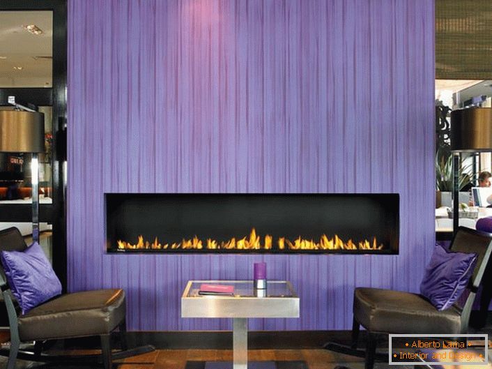 A large electric fireplace is part of the heating system at home. The aesthetic appearance looks harmoniously in the modern interior.