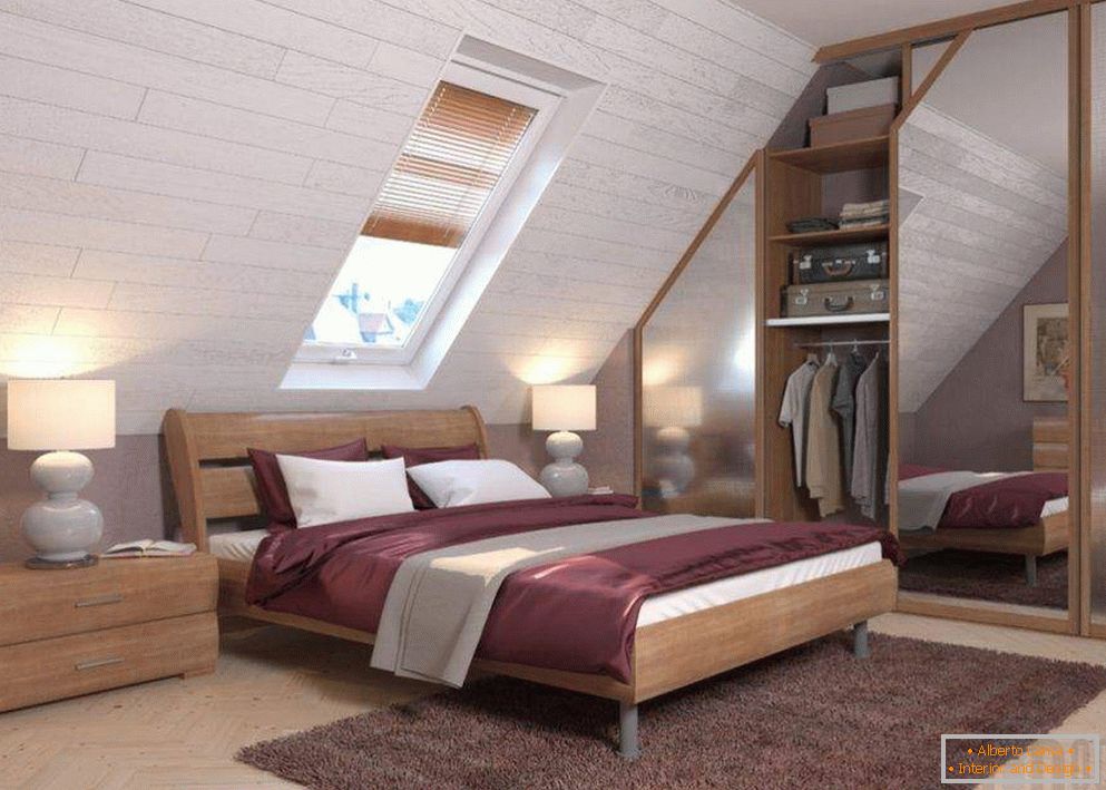 Built-in wardrobe in the bedroom with a mansard ceiling