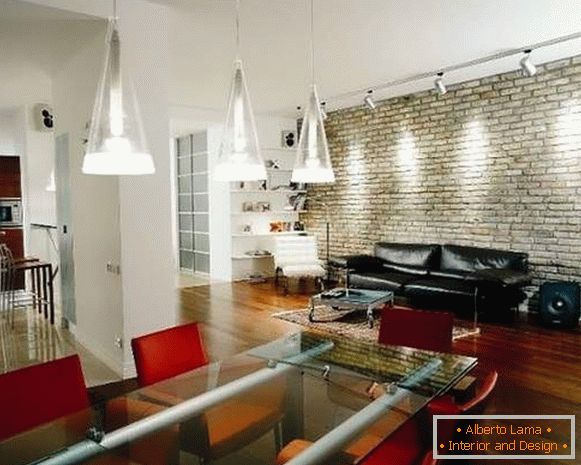 Loft interior design of a two-room apartment - a photo of a kitchen in the living room