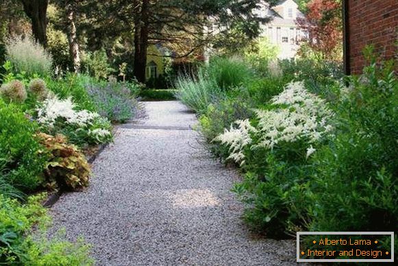 Wide garden path of gravel