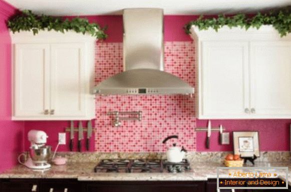 Pink walls and black and white furniture in the kitchen