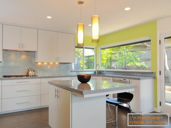 Kitchen with light green wallpaper