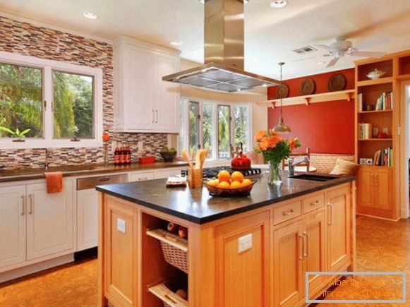 Bright and warm kitchen with a red wall