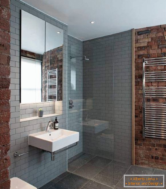 The combination of a brick wall and gray tiles in the interior