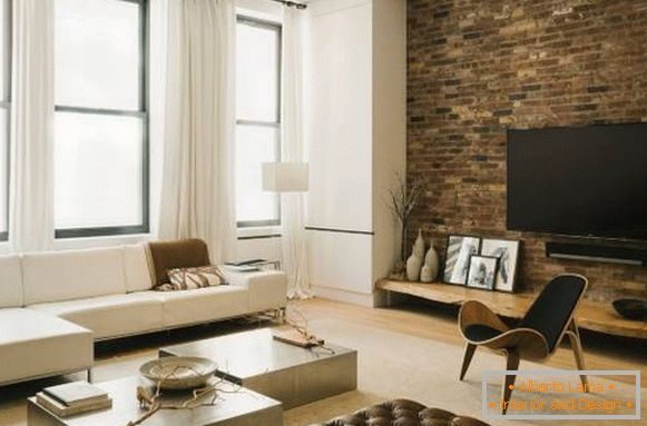 The design of the brick wall in the interior of the living room in a modern style
