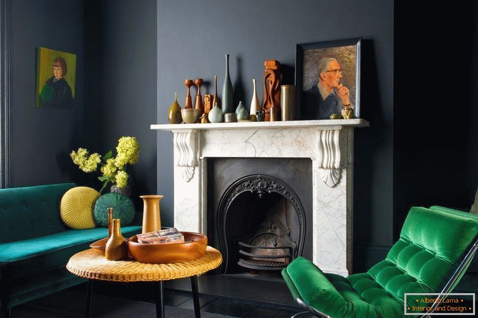 A green armchair by the fireplace