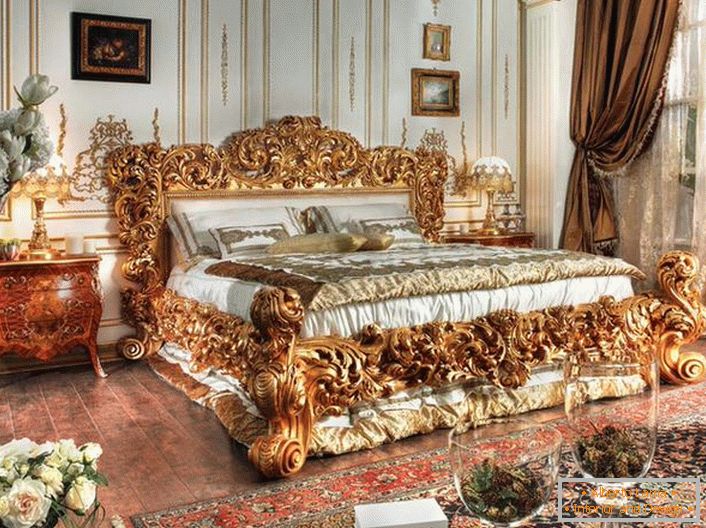 A luxurious bed is made in the best traditions of Empire style. Massive backs of a bed of carved wood of noble golden color stand out against the background of other interior details.