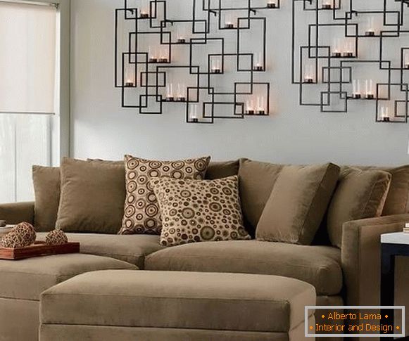 Forged candlesticks on the wall in modern living room interior