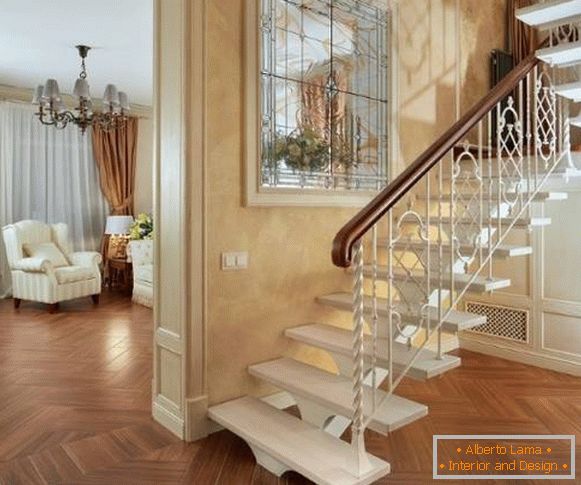 Metal staircases in a private house with forged rails