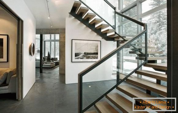 Metal stairs in the house on the second floor - photo