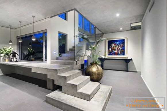 Modern house with a concrete staircase to the second floor
