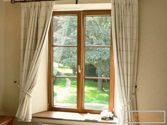 Short curtains in the kitchen in the country style - photo beige
