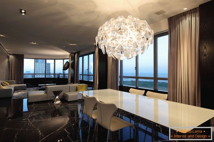 A massive chandelier for the living room in high-tech style gives enough light. Futuristic design - a stylish solution for the interior.