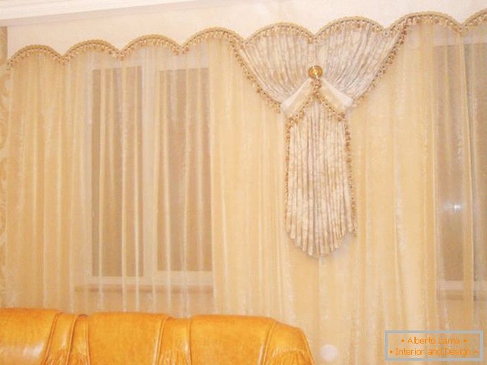 Delicate beige curtains of transparent fabric look great in tandem with ivory-colored lambrequins.