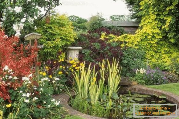 Artificial pond in the landscape design of a private house