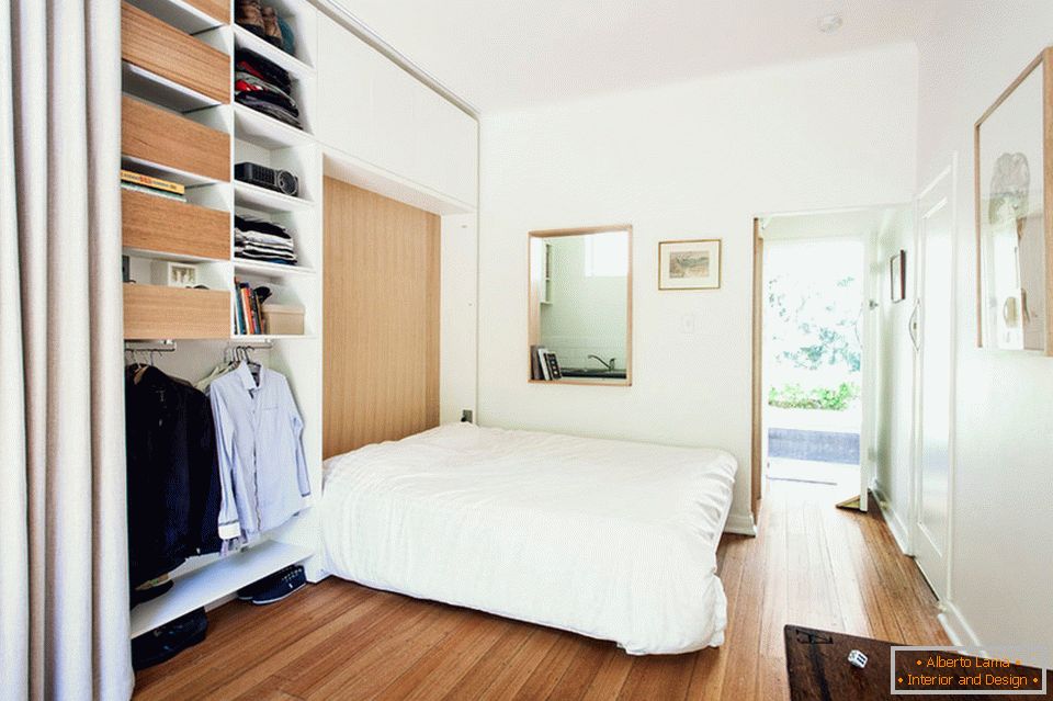 Folding bed in a small studio apartment