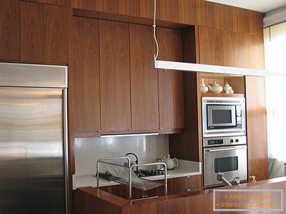 Small kitchen with wooden cupboards