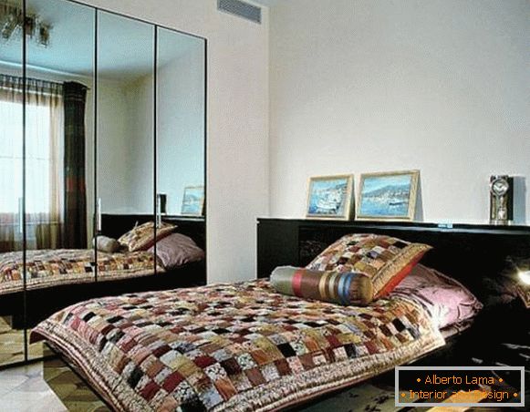 Large mirror in a small bedroom