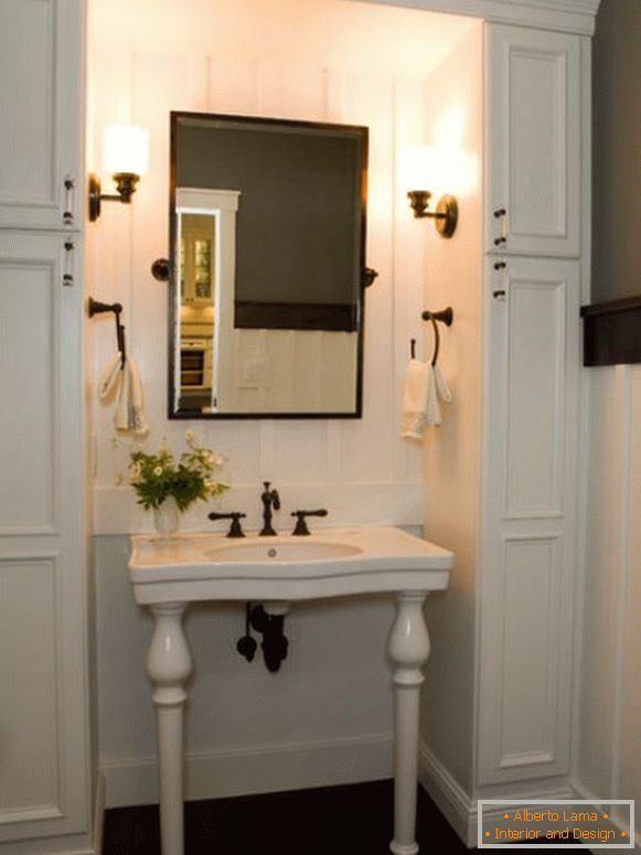 Wash table with mirror and towel holders in the bathroom
