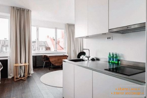 Kitchen design in a small studio apartment - minimalist photo