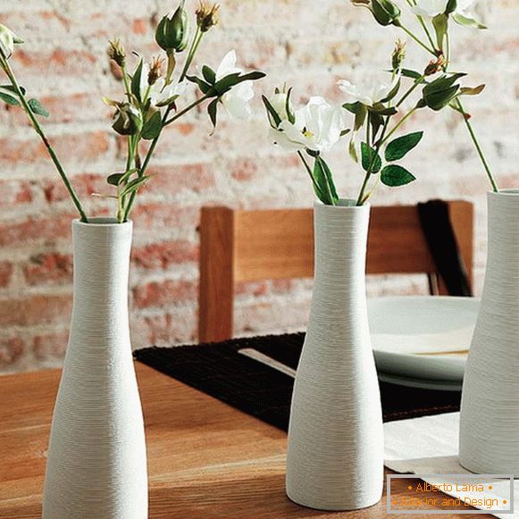 Vases with flowers on the table