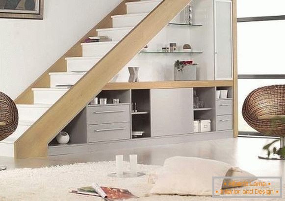 Design of stairs in a private house - photo with built-in furniture