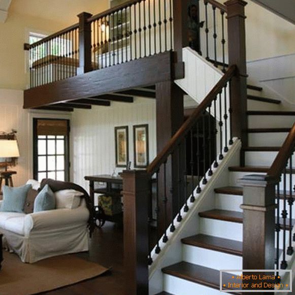 Beautiful staircase design in a private house with wooden handrails