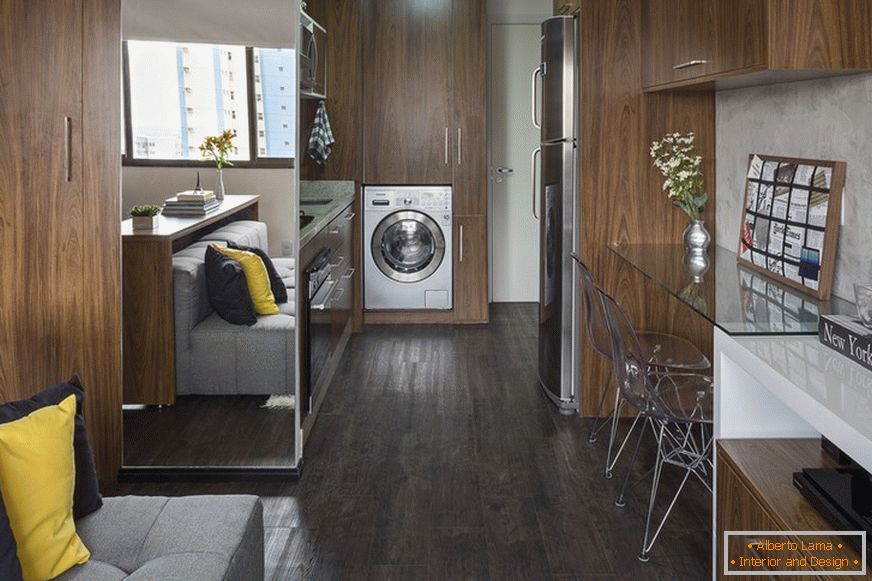 Compact kitchen and built-in washing machine in a small apartment in Brazil