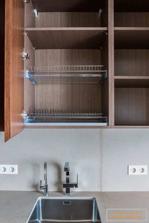 Cabinet for dishes in the kitchen with the effect of optical illusion