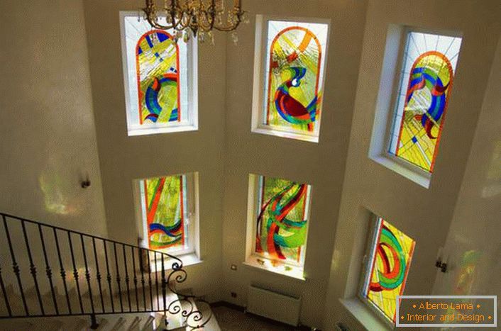 Luxurious decoration of windows with stained glass. Several elements are united in a single picture. 